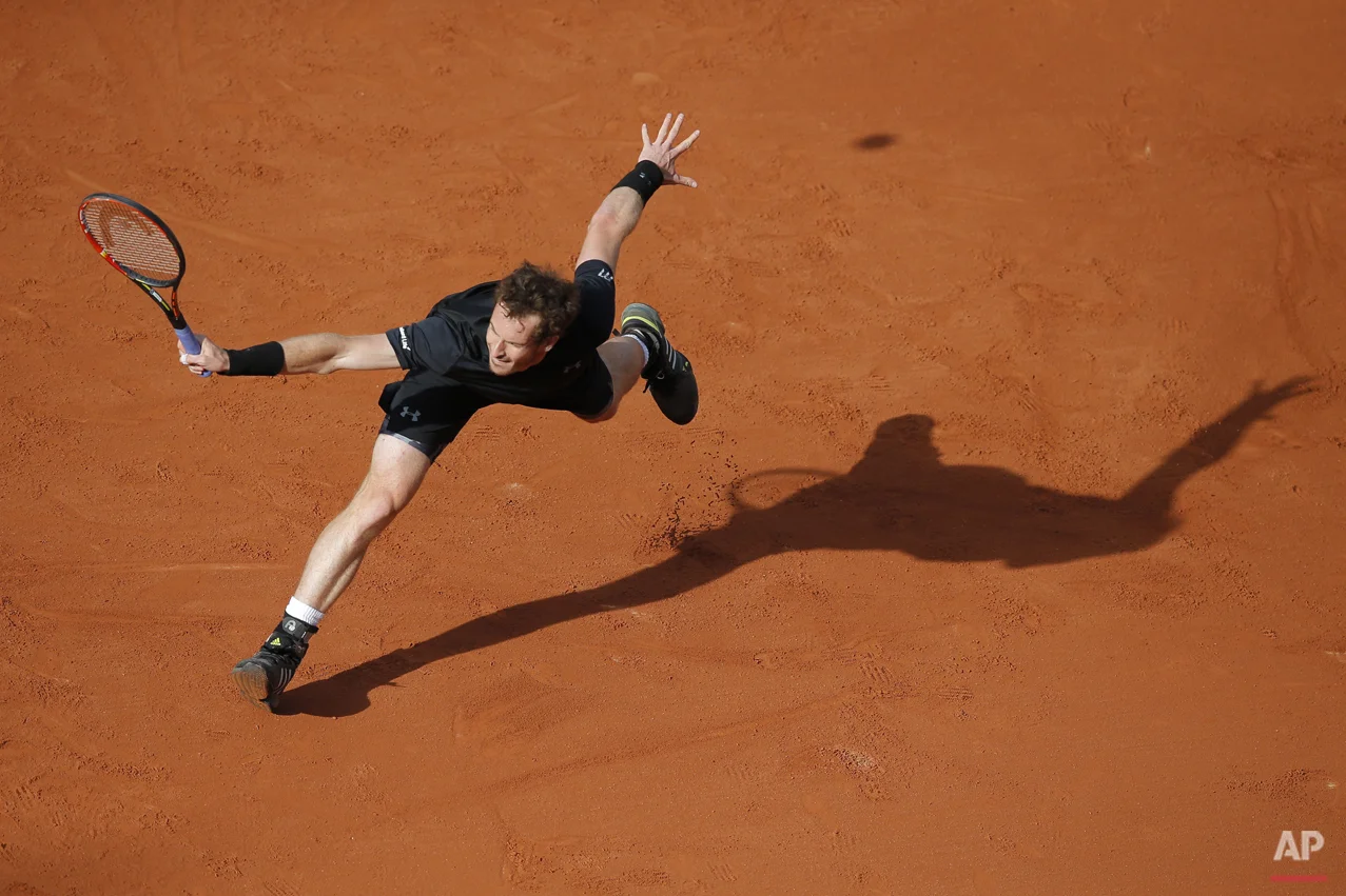  Britain's Andy Murray returns in the first round match of the French Open tennis tournament against Argentina's Facundo Arguello at the Roland Garros stadium, in Paris, France, Monday, May 25, 2015. (AP Photo/Christophe Ena) 