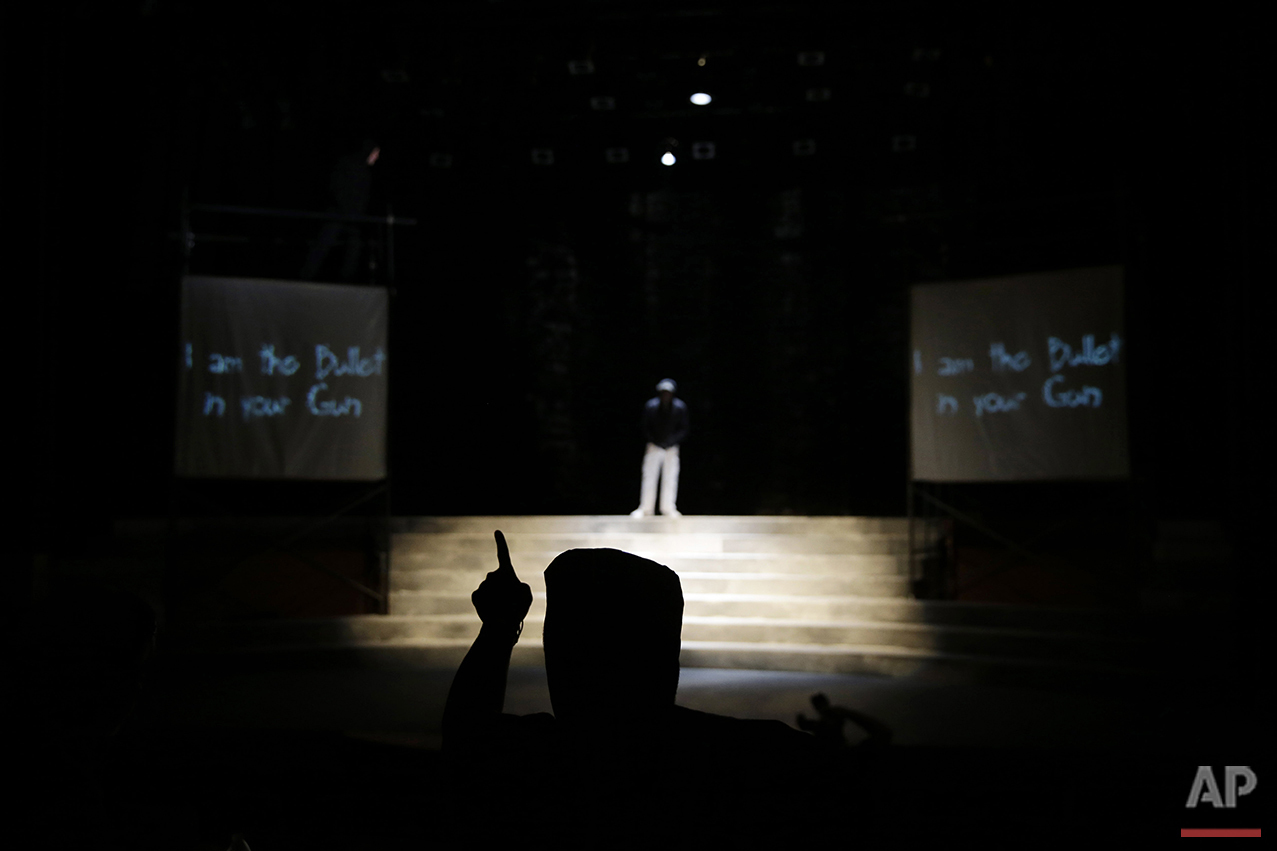  In this Tuesday, May 10, 2016, photo, director Rajendra Ramoon Maharaj leads a rehearsal for The Ballad of Trayvon Martin at the New Freedom Theatre in Philadelphia. The play, about the death of 17-year-old Trayvon Martin, opens Thursday. (AP Photo/