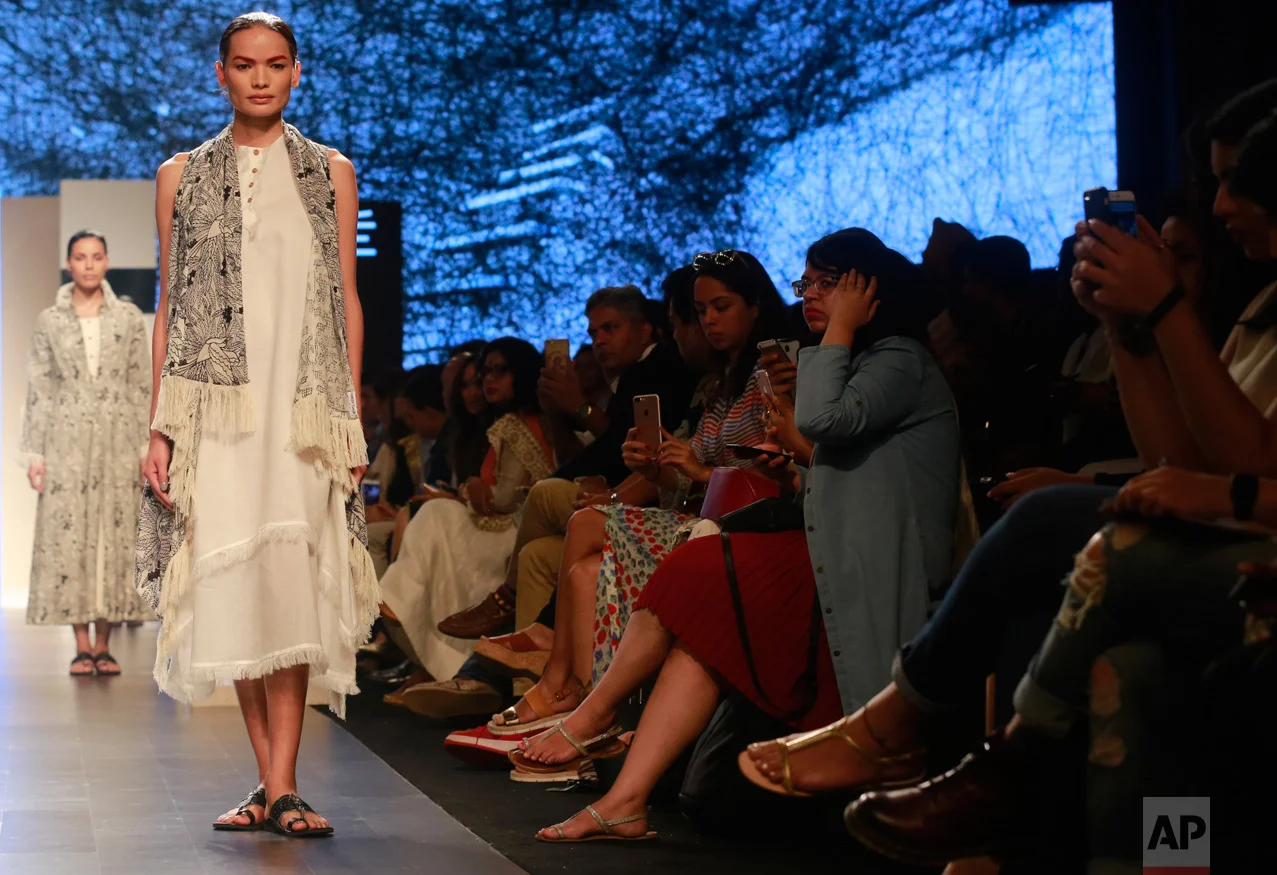 In this Feb. 1, 2017 photo, Anjali Lama, a transgender model from Nepal, displays a creation by designer Gen Next during Lakme Fashion week in Mumbai, India. To model for Lakme Fashion Week, one of the highlights of India's fashion calendar, is Lama's big moment. It's a dream that was years in the making and often seemed far beyond the reach of Lama now being touted as the first transgender woman to model for the high fashion event sponsored by a top Indian cosmetics brand. (AP Photo/Rafiq Maqbool)