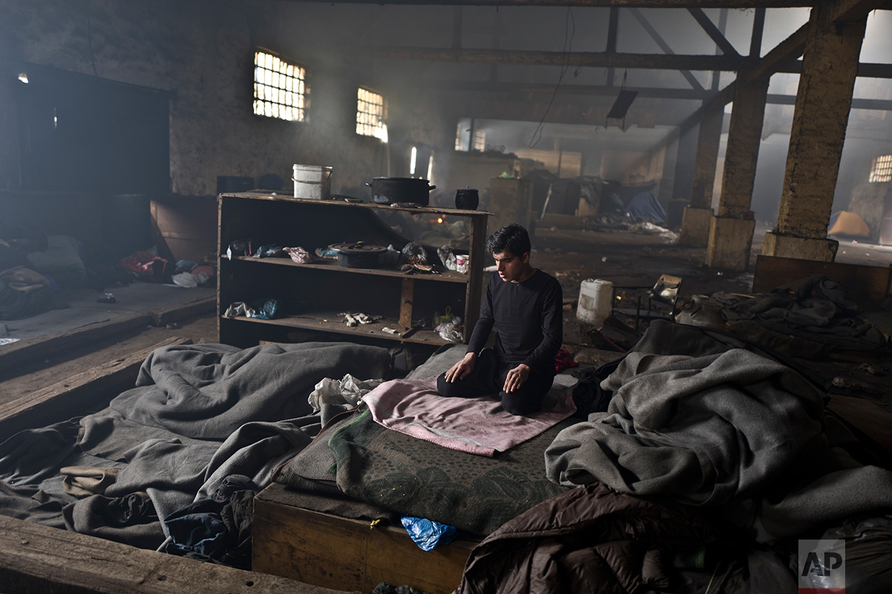  An Afghan refugee prays in an abandoned warehouse where he and other migrants took refuge in Belgrade, Serbia, Friday, Feb. 3, 2017. &nbsp;(AP Photo/Muhammed Muheisen) 
