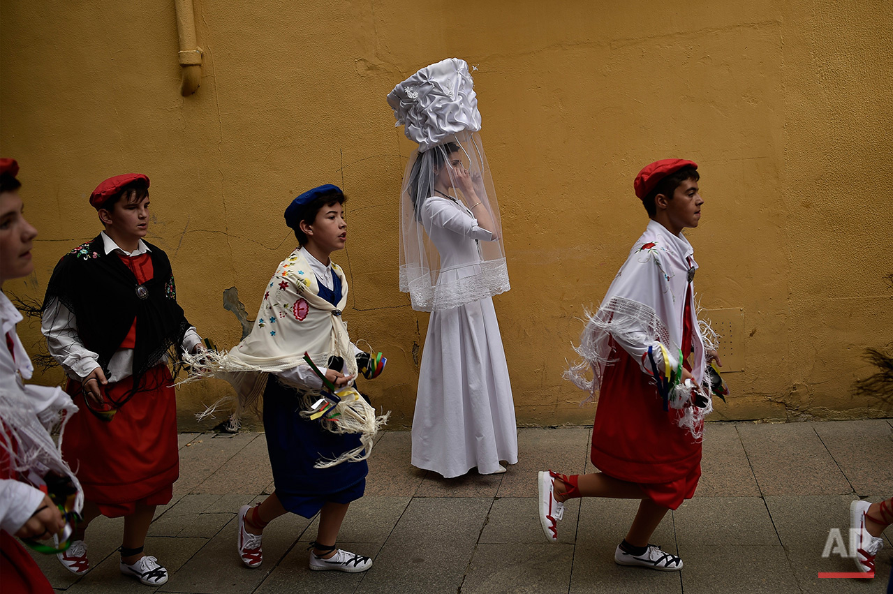  A participant of  ''Bread Procession of the Saint'', takes part in the ceremony in honor of Domingo de La Calzada Saint (1019-1109) who helped poor people and pilgrimage, in Santo Domingo de La Calzada, northern Spain, Wednesday, May 11, 2016.  Ever