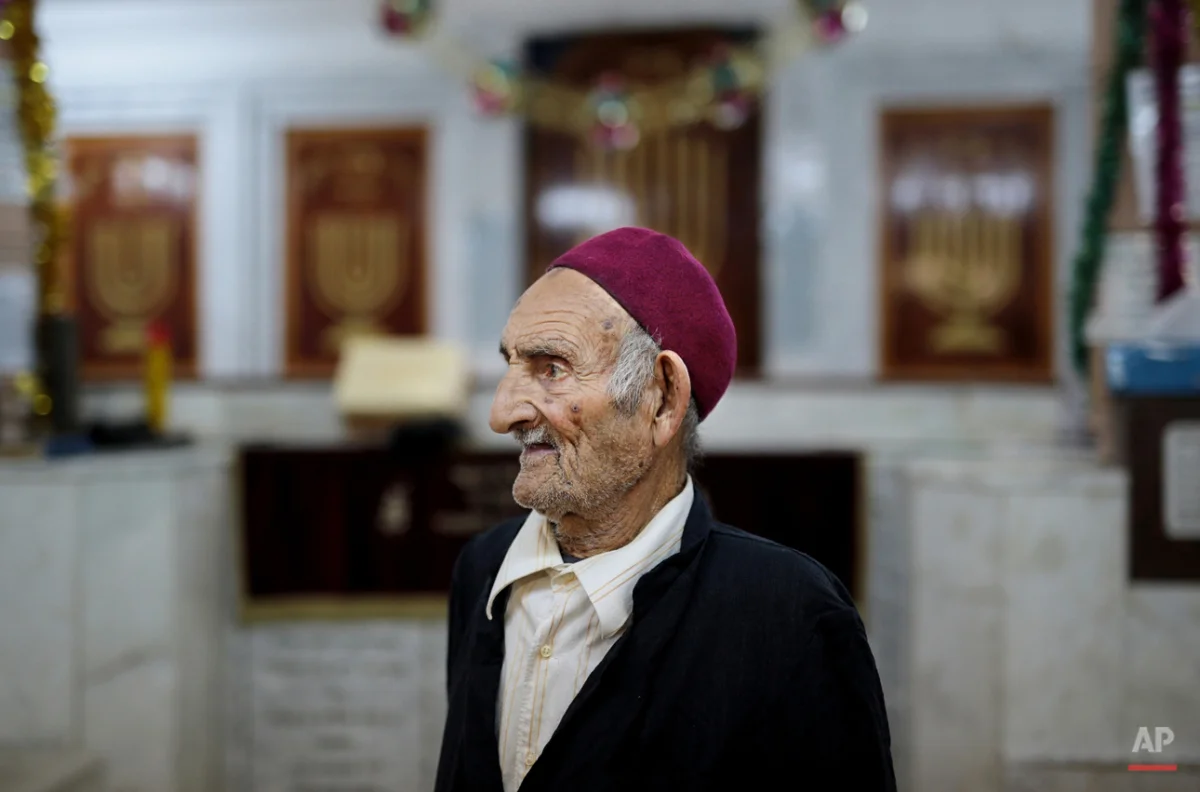  In this Thursday, Oct. 29, 2015 photo, a caretaker of the Synagogue of the Kohanim of Djirt, pauses before prayers, at Hara Kbira, the main Jewish neighborhood on the Island of Djerba, southern Tunisia. The Jewish community in the resort island of D