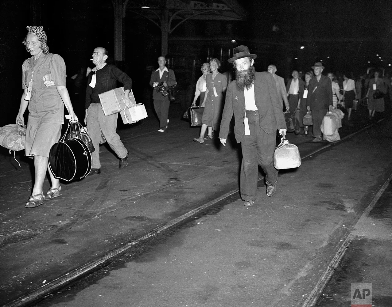 In this Aug. 4, 1944 photo, civilian refugees from occupied Europe arrive at Hoboken, N.J., during World War II. The refugees, who will be given sanctuary for the duration of the war, will go to Fort Ontario, Oswego, N.Y., where an emergency relief shelter was established. Jewish refugees from Europe were blocked during and after World War II _ first because of fears that they might be German sympathizers, then because of fears that they were Communists. (AP Photo)