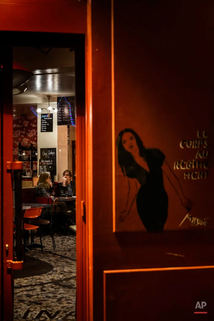  In this Nov. 17, 2015 picture people enjoy dinner at 'Chez Gladines' close to one of the spots of Friday's attacks in Paris. Parisians are returning to cafes, bars and restaurants, determined that the Nov. 13 attacks won't alter the city's way of li