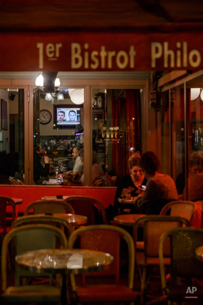  In this Nov. 17, 2015 picture people enjoy dinner at '1er Bistrot Philo'  close to one of the spots of Friday's attacks in Paris. Parisians are returning to cafes, bars and restaurants, determined that the Nov. 13 attacks won't alter the city's way 
