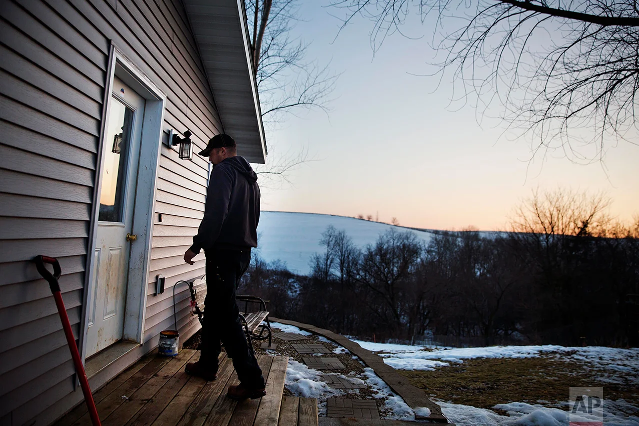 Jeff McCullick walks into his home in Ferryville, Wis., Wednesday, Jan. 18, 2017. McCullick voted for Donald Trump, with gun rights being a major factor in his decision. He's an avid hunter who feared Hillary Clinton's tougher stance on guns could ultimately lead to him losing his rifles and shotguns. (AP Photo/David Goldman)