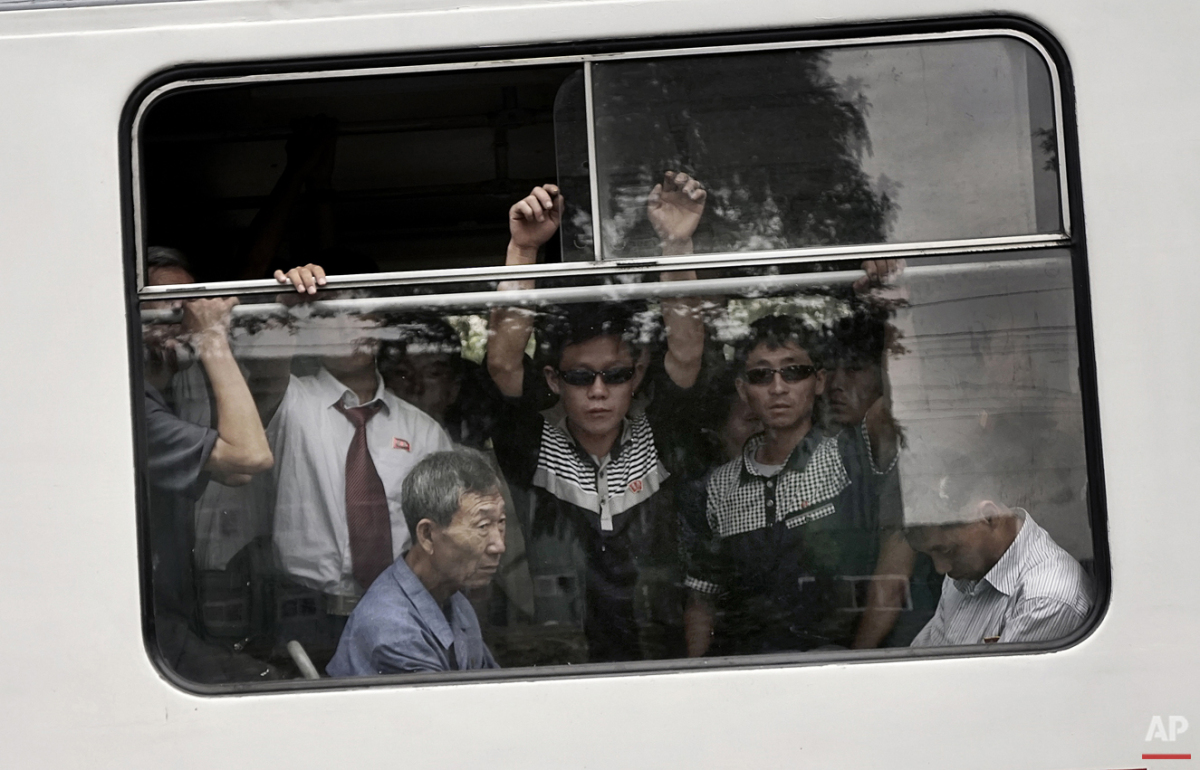  Commuters ride on a city trolley bus, Friday, Sept. 11, 2015 in Pyongyang, North Korea. The city trolley is one of the more common forms of public transportation among North Koreans living in Pyongyang. (AP Photo/Maye-E Wong) 