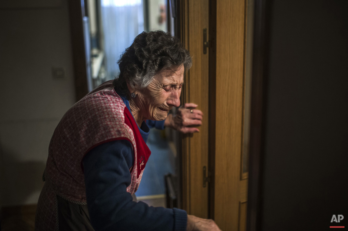  Carmen Martinez Ayuso, 85-years old, cries during her eviction in Madrid, Spain, Friday, Nov. 21, 2014. Carmen Martinez Ayuso lost her foreclosed apartment to a moneylender after she could not afford to pay her debt and the high interest rates due t