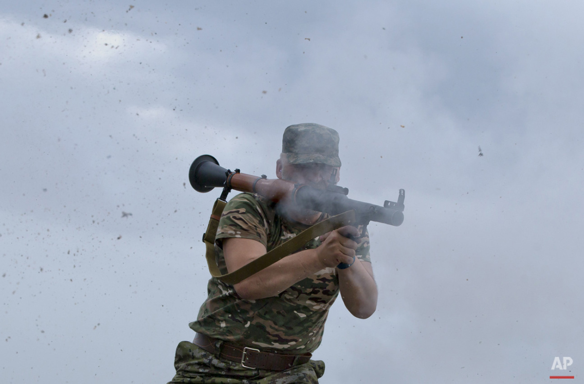  Series chronicling the continuing war in Ukraine. 

A pro-Russian rebel fires a rocket propelled grenade on the rooftop of an apartment building during clashes with Ukrainian troops on the outskirts of Luhansk, Ukraine, Monday, June 2, 2014. Hundred