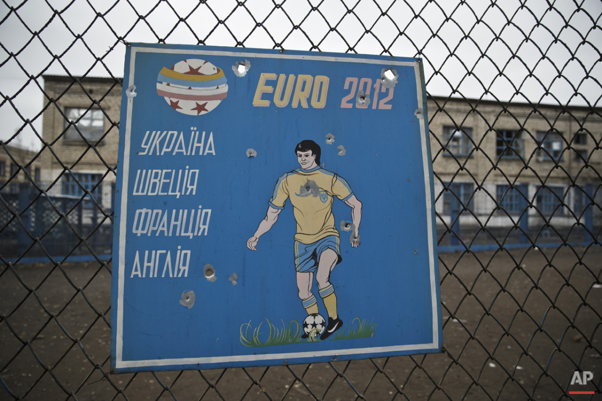  The Euro 2012 soccer championship Group D teams, Ukraine, Sweden, France and England are listed on a bullet riddled metal sheet attached to the fence of the inmates sports area inside the destroyed prison in Chornukhyne, Ukraine, Monday, March 2, 20
