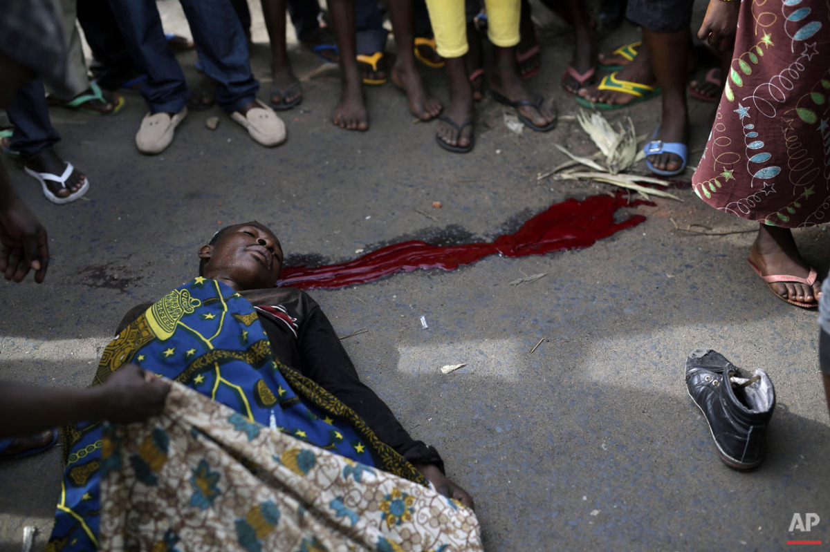  A protester lays dead after being shot in the Kinama district of Bujumbura, Burundi, Thursday May 7, 2015.  (AP Photo/Jerome Delay) 
