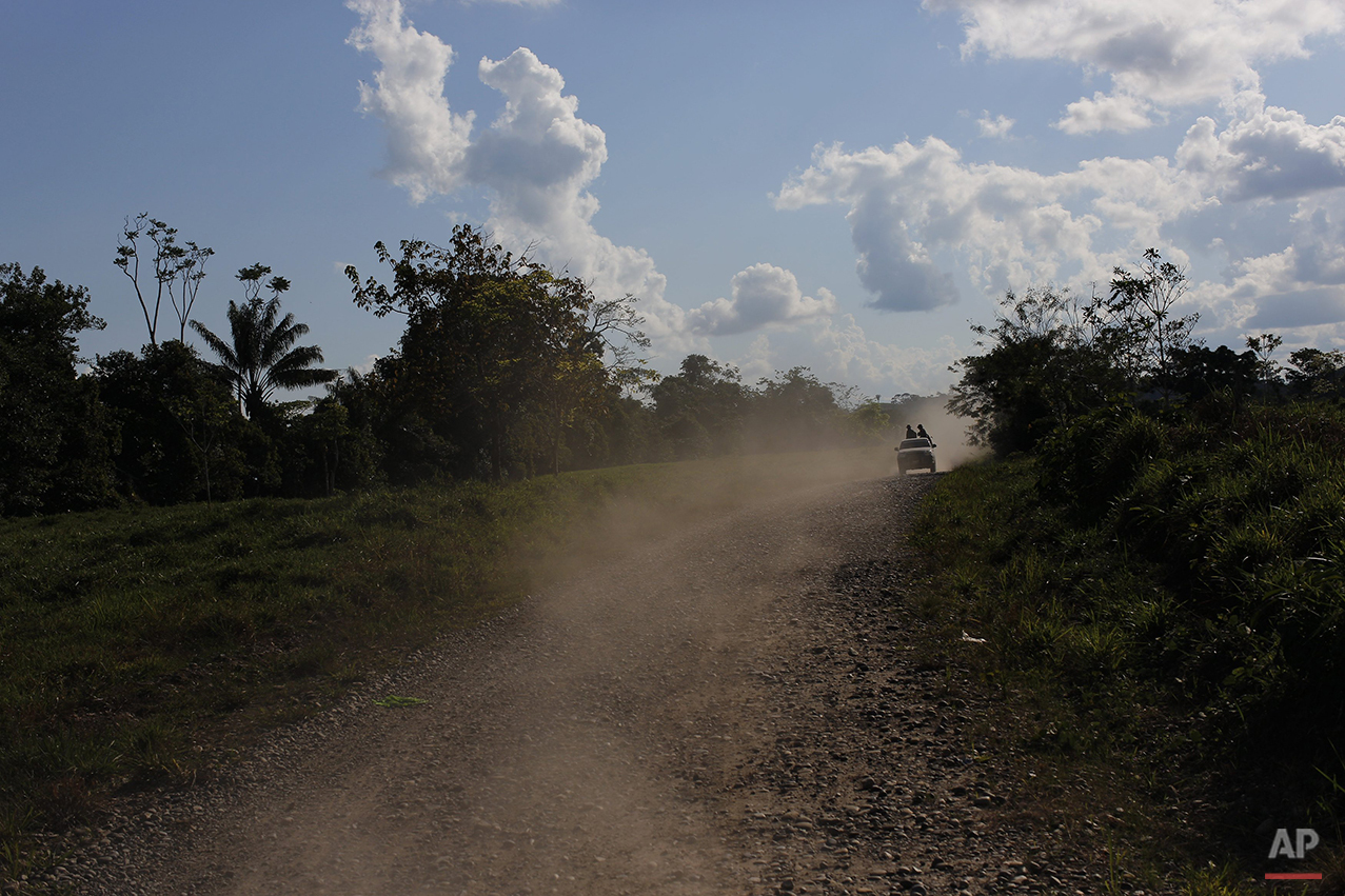  In this July 28, 2015 photo, counternarcotics special forces ride on pick-up truck as they head to blow a hole in a clandestine airstrip used by drug traffickers near Ciudad Constitucion, Peru. The task force left base in three trucks, then forded s