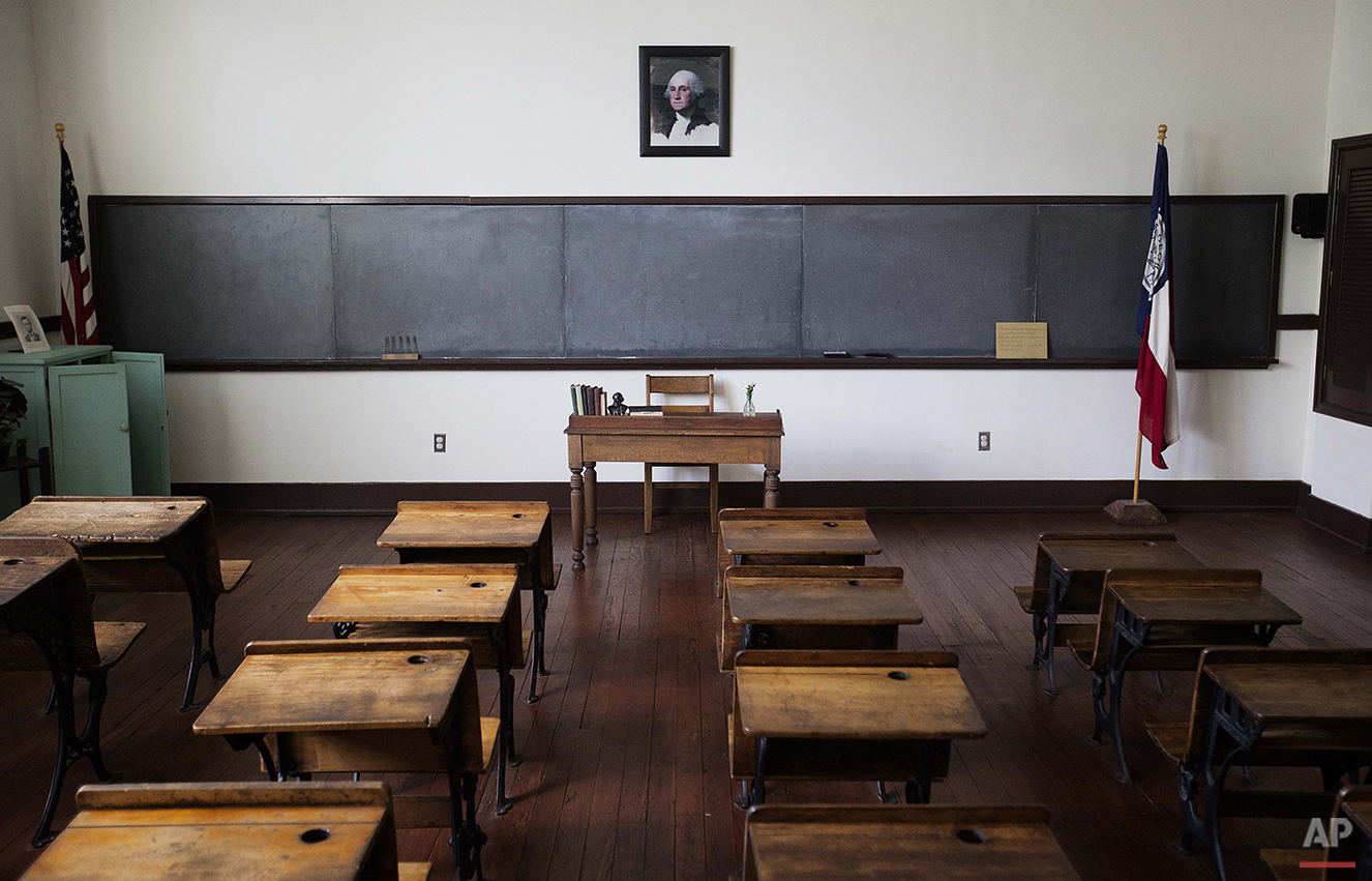  A classroom of former President Jimmy Carter from when he attended Plains High School in 1937 is exhibited in what is now the Jimmy Carter National Historic Site in his hometown of Plains, Ga., Saturday, Aug. 22, 2015. Carter remains the biggest dra