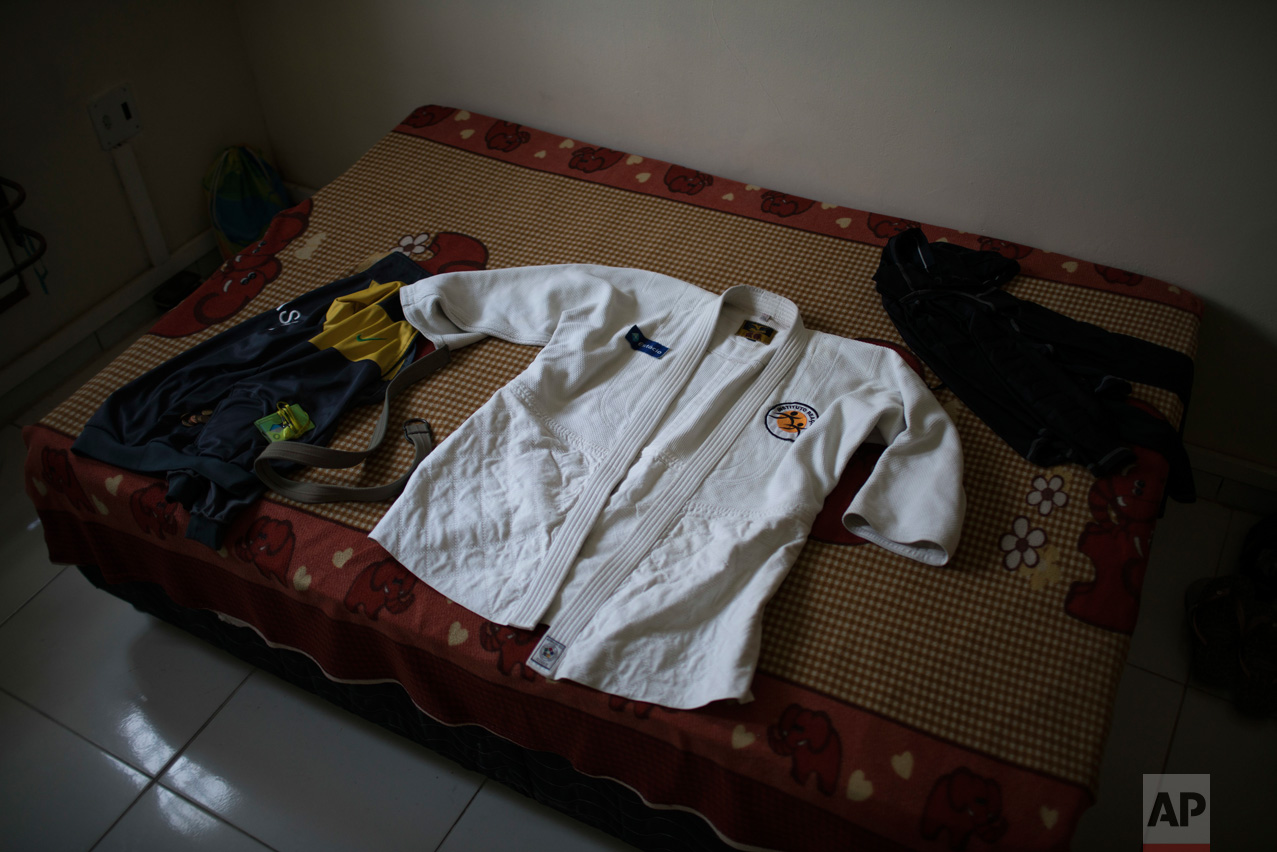  In this May 28, 2016 photo, the judo gi of Yolande Mabika, a refugee from the Democratic Republic of Congo, sits on her bed after she cleaned it at her newly rented apartment in Rio de Janeiro, Brazil. Mabika is hopeful that she will be part of the 