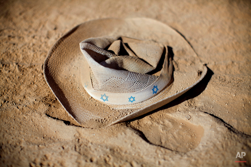  In this photo taken Friday, June 6, 2014, a hat with stars of david lays on the ground during Israelís first Midburn festival, modeled after the popular Burning Man festival held annually in the Black Rock Desert of Nevada, in the desert near the Is