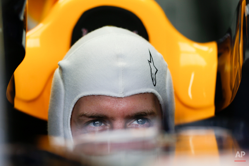  Red Bull driver Sebastian Vettel from Germany sits inside his car during a free practice at the Interlagos race track in Sao Paulo, Brazil, Friday, Nov. 22, 2013. The Brazilian Formula One Grand Prix will take place on Sunday. (AP Photo/Felipe Dana)