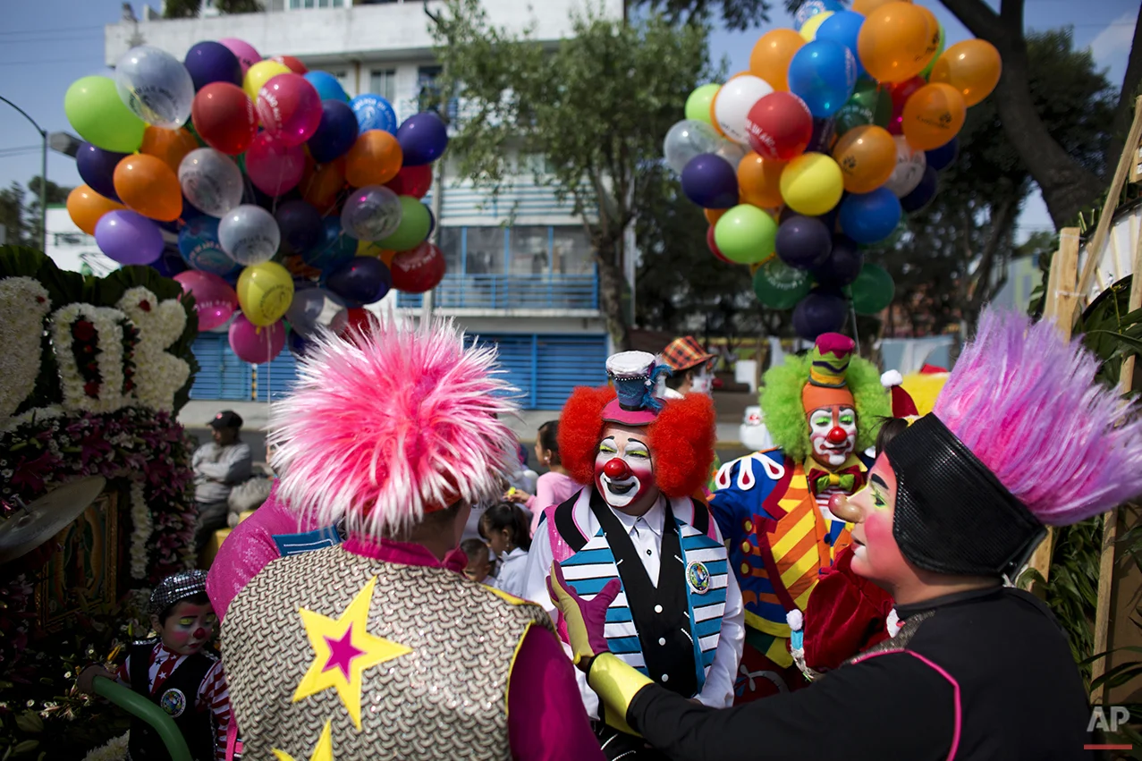 Clowns gather for a procession toward the Basilica of Our Lady of Guadalupe in Mexico City, Monday, Dec. 14, 2015. Hundreds of clowns belonging to various clown associations made their annual pilgrimage to the Basilica on Monday to pay their respects to the Virgin of Guadalupe, Mexico's patron saint. (AP Photo/Rebecca Blackwell)