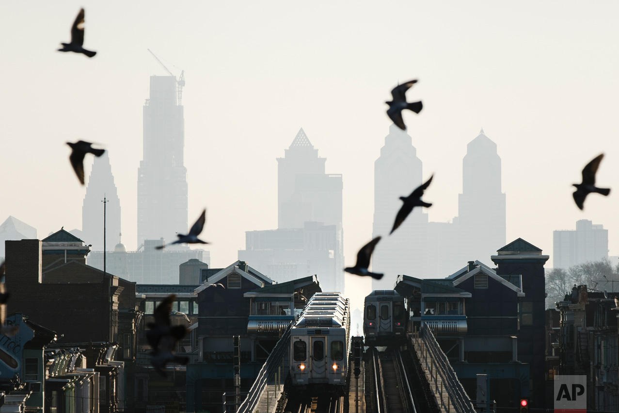 Birds fly over trains along the Market-Frankford Line in Philadelphia, Monday, Feb. 6, 2017. The Southeastern Pennsylvania Transportation Authority took cars out for inspection after a crack was found on a main load-carrying beam on a Market-Frankford Line car during regularly scheduled vehicle overhaul work. (AP Photo/Matt Rourke)