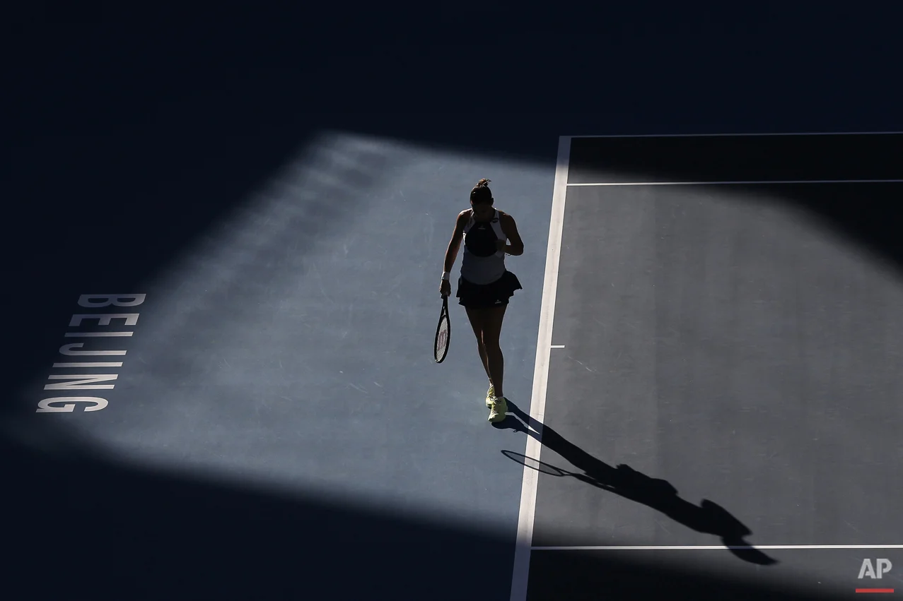 Flavia Pennetta of Italy reacts after missing a point to Anastasia Pavlyuchenkova of Russia during their women's singles match of the China Open tennis tournament at the National Tennis Stadium in Beijing, Thursday, Oct. 8, 2015. (AP Photo/Andy Wong)
