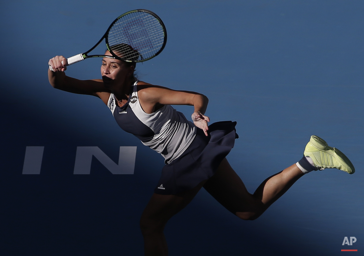  Flavia Pennetta of Italy hits a return shot against Anastasia Pavlyuchenkova of Russia during their women's singles match of the China Open tennis tournament at the National Tennis Stadium in Beijing, Thursday, Oct. 8, 2015. (AP Photo/Andy Wong) 