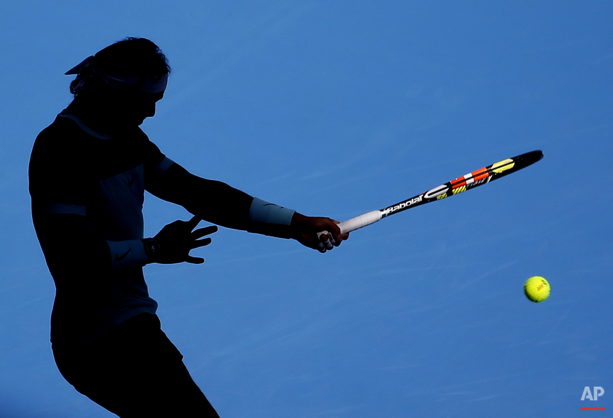  Rafael Nadal of Spain hits a return shot against Jack Sock of the United States during their men's singles quarterfinal match of the China Open tennis tournament at the National Tennis Stadium in Beijing, Friday, Oct. 9, 2015. (AP Photo/Andy Wong) 