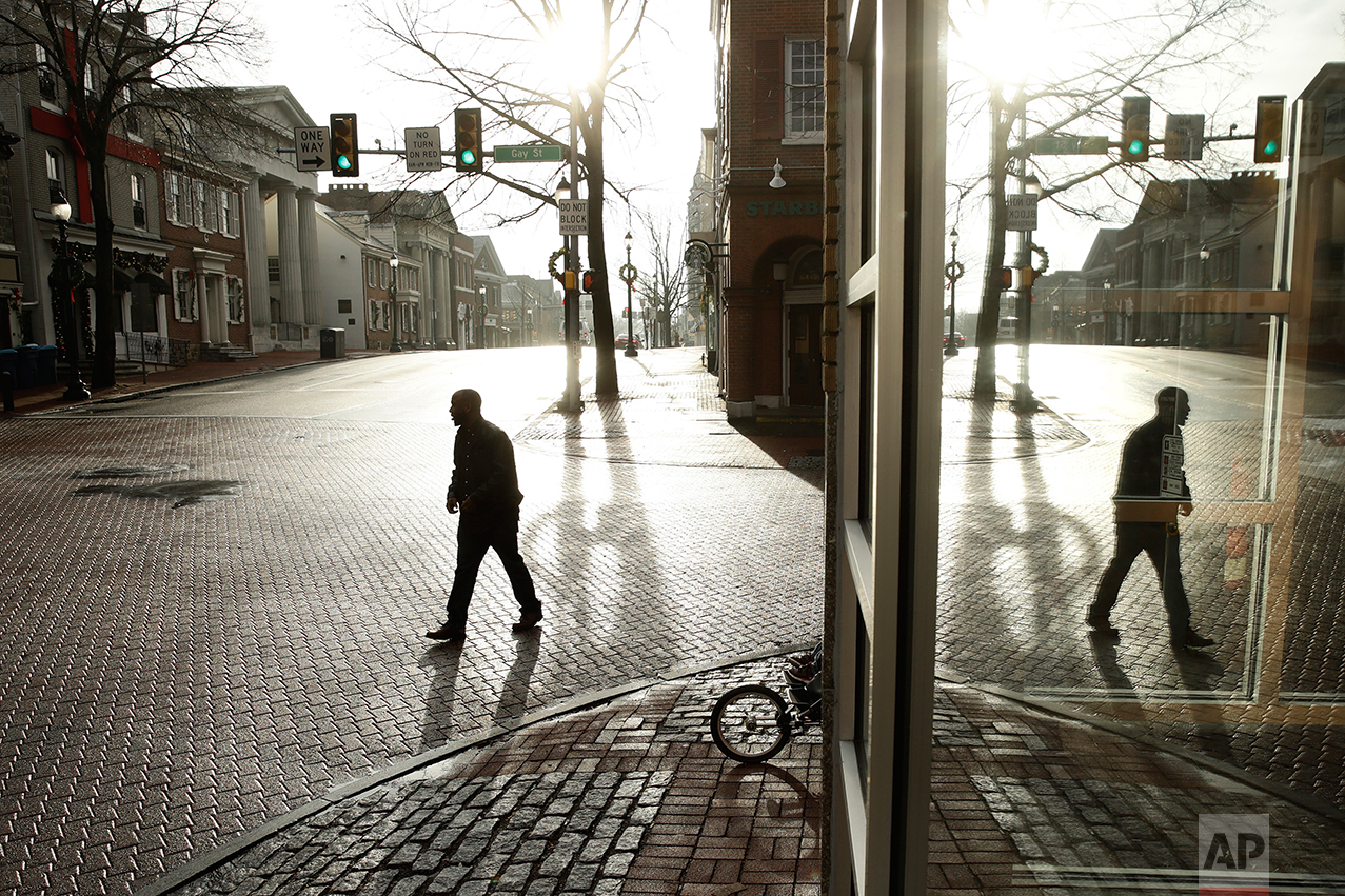  A pedestrian walks along Gay Street in West Chester, Pa., Wednesday, Jan. 4, 2017. Chester is the richest county in Pennsylvania; it is majority Republican, but Democratic presidential candidate Hillary Clinton won here easily in 2016. (AP Photo/Mat