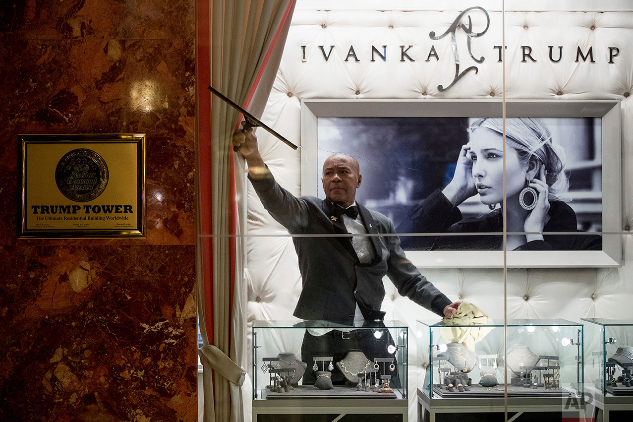  A worker cleans the windows of the Ivanka Trump Collection in the lobby of Trump Tower in New York, Tuesday, Jan. 17, 2017. (AP Photo/Andrew Harnik) 