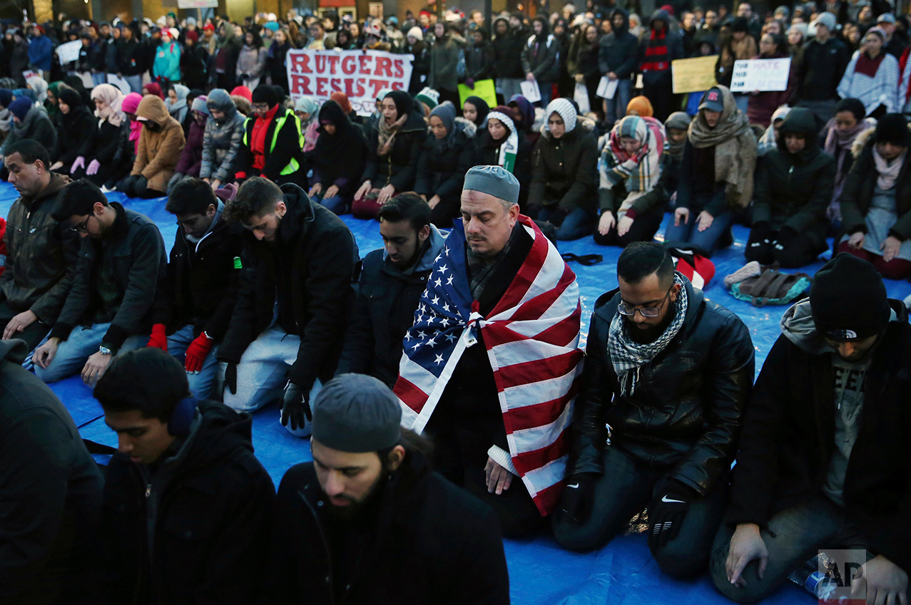  Rutgers University students and supporters gather for Muslim Prayers during a rally to express discontent with President Donald Trump's executive order halting some immigrants from entering the United States on Tuesday, Jan. 31, 2017, in New Brunswi