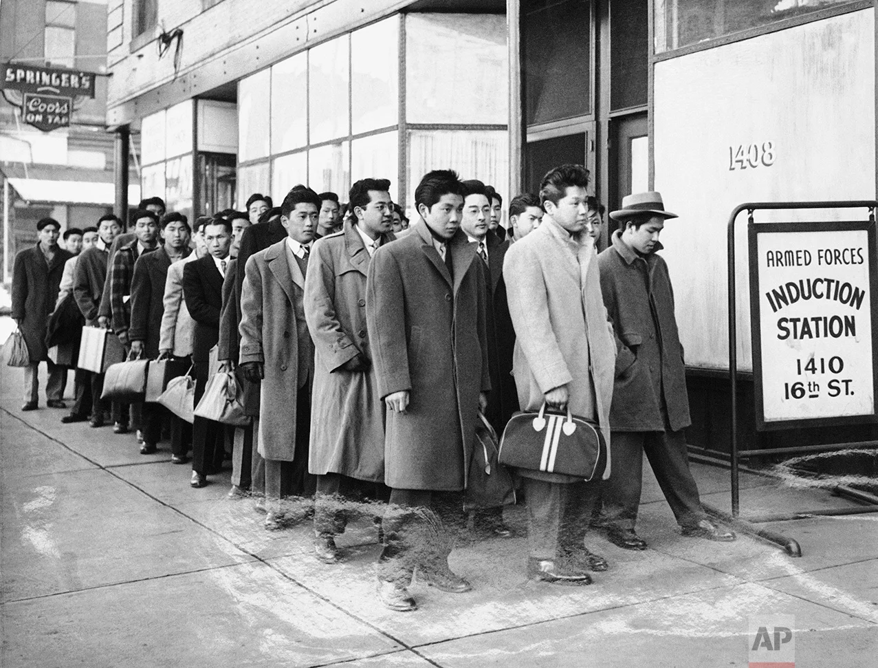These 48 Japanese Americans from the Granada Relocation Center near Lamar, Colorado, reported for preinduction physical examinations at the Denver Induction Station Tuesday, February 22, 1944. (AP Photo)