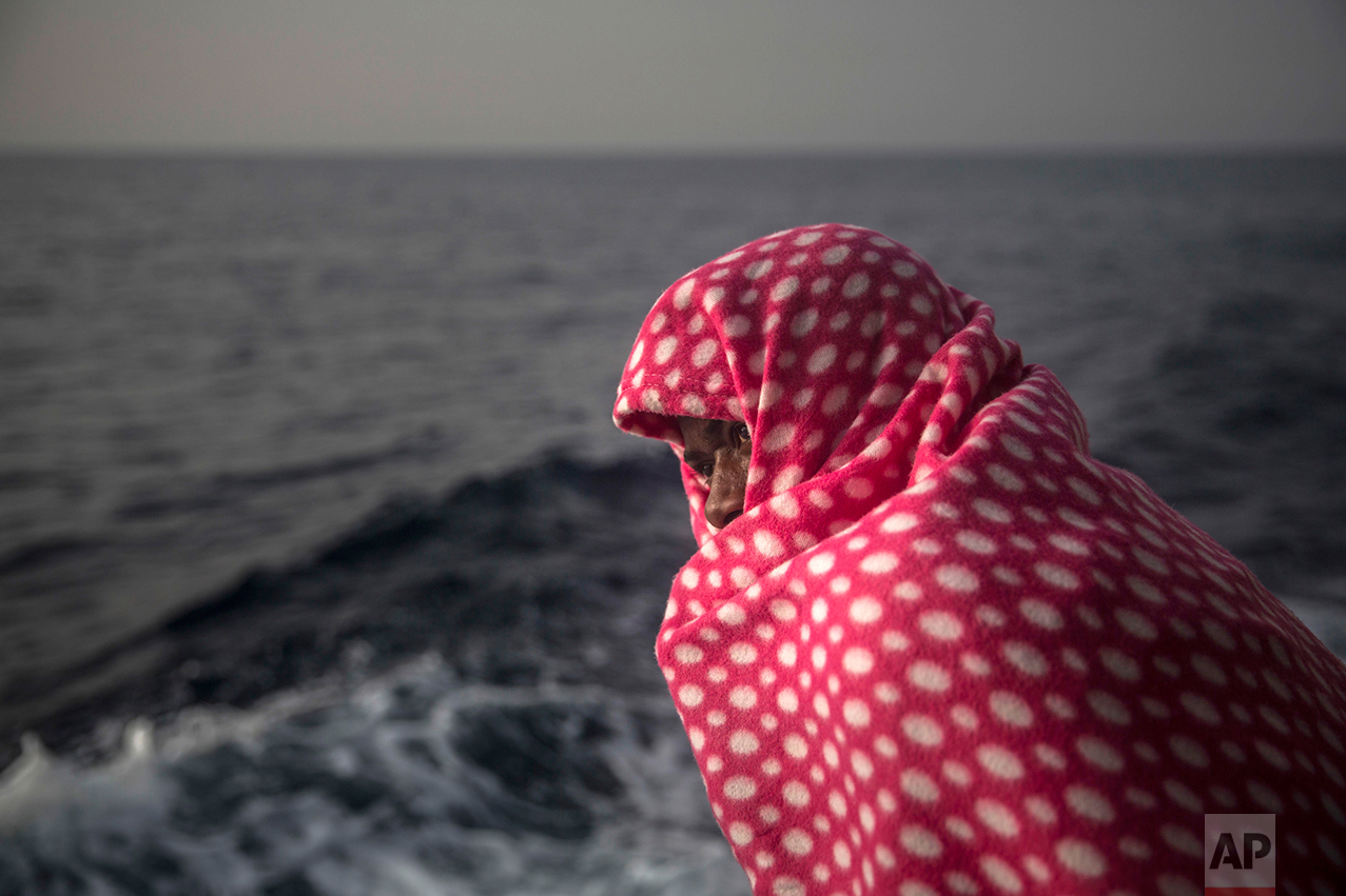 A man rests aboard Golfo Azurro, the Spanish NGO Proactiva Open Arms rescue ship, after being rescued from a boat out of control at 25 miles north of Sabratha, off the Libyan coast, early in the morning on Thursday Feb. 23, 2017. (AP Photo/Santi Palacios)