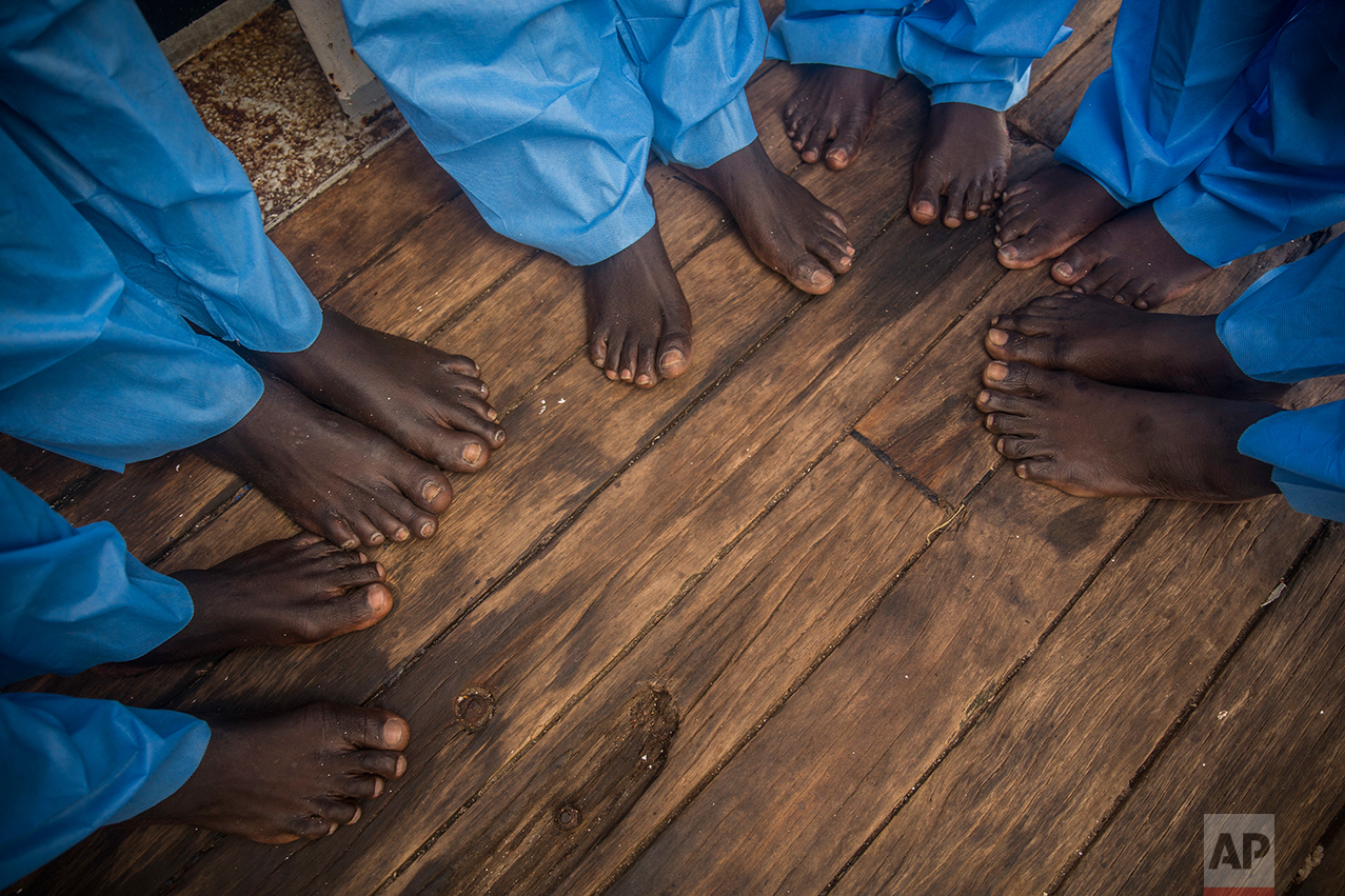 African refugees and migrants, mostly from Sudan and Senegal, rest aboard Golfo Azurro, the Spanish NGO Proactiva Open Arms rescue ship, after being rescued from a boat out of control at 25 miles north of Sabratha, off the Libyan coast, early in the morning on Thursday Feb. 23, 2017. (AP Photo/Santi Palacios)