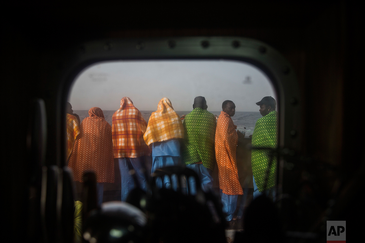 African refugees and migrants, mostly from Sudan and Senegal, look at the sea aboard Golfo Azurro, the Spanish NGO Proactiva Open Arms rescue ship, after being rescued from a boat out of control at 25 miles north of Sabratha, off the Libyan coast, early in the morning on Thursday Feb. 23, 2017. (AP Photo/Santi Palacios)