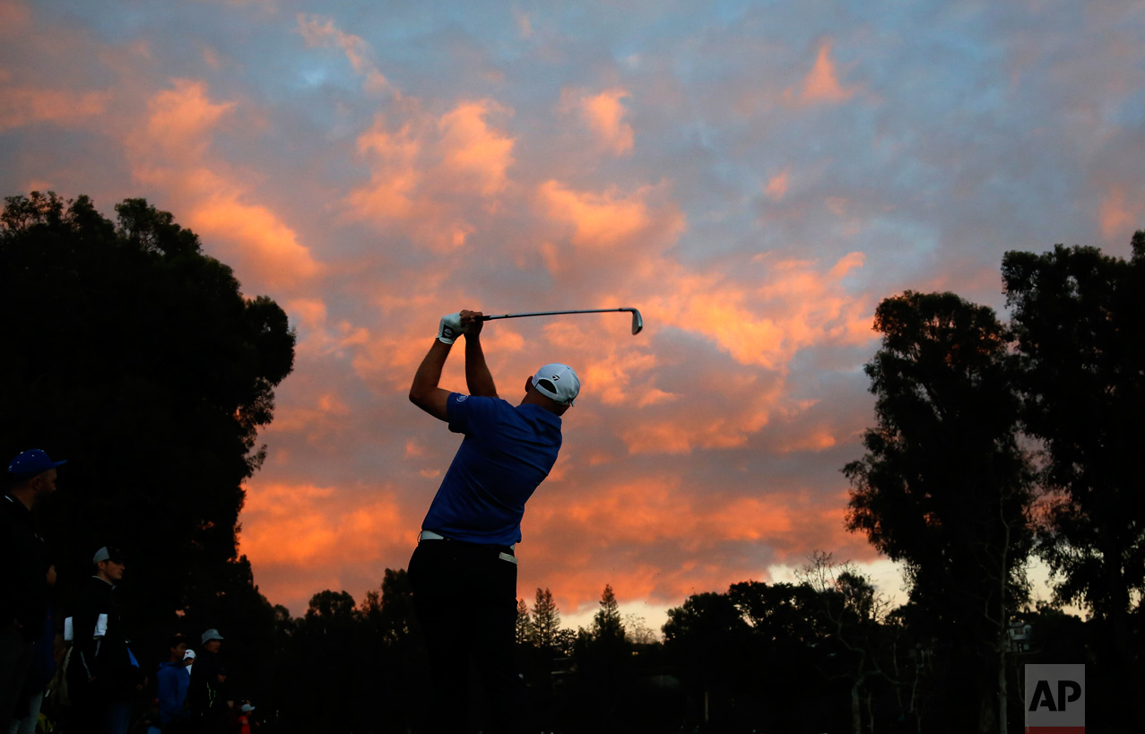 Cameron Percy hits his approach shot on the first hole during the third round of the Genesis Open golf tournament at Riviera Country Club, Saturday, Feb. 18, 2017, in the Pacific Palisades area of Los Angeles. (AP Photo/Ryan Kang)