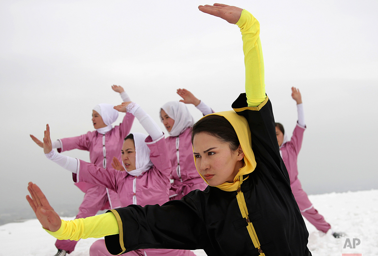  Shaolin martial arts students follow their trainer, Sima Azimi, 20, in black, during a practice session on a hilltop in Kabul, Afghanistan, Tuesday, Jan. 25, 2017. The ten ethnic Hazara women and girls practice the martial arts of Shaolin on a hillt