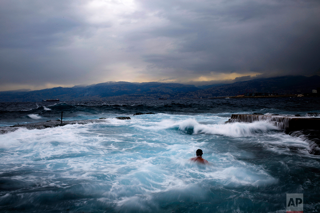  Men swim during in the early morning in the Mediterranean sea in cool temperatures of 8 degrees celsius, 46.4 Fahrenheit, across Beirut, Lebanon, Thursday, Feb. 16, 2017. (AP Photo/Hassan Ammar) 