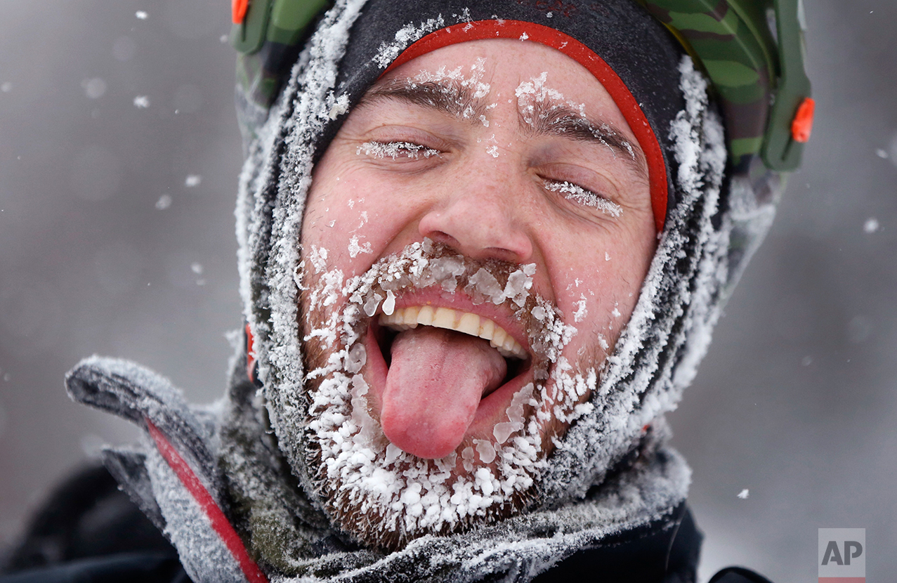  Cyclist David Cassidy of Bangor, Maine, enjoys the moment after crossing the finish line in an 18-mile bike race at the Fat Tire Festival at the Sugarloaf ski resort, Saturday, Feb 11, 2017, in Carrabassett Valley, Maine. Riders had to endure heavy 