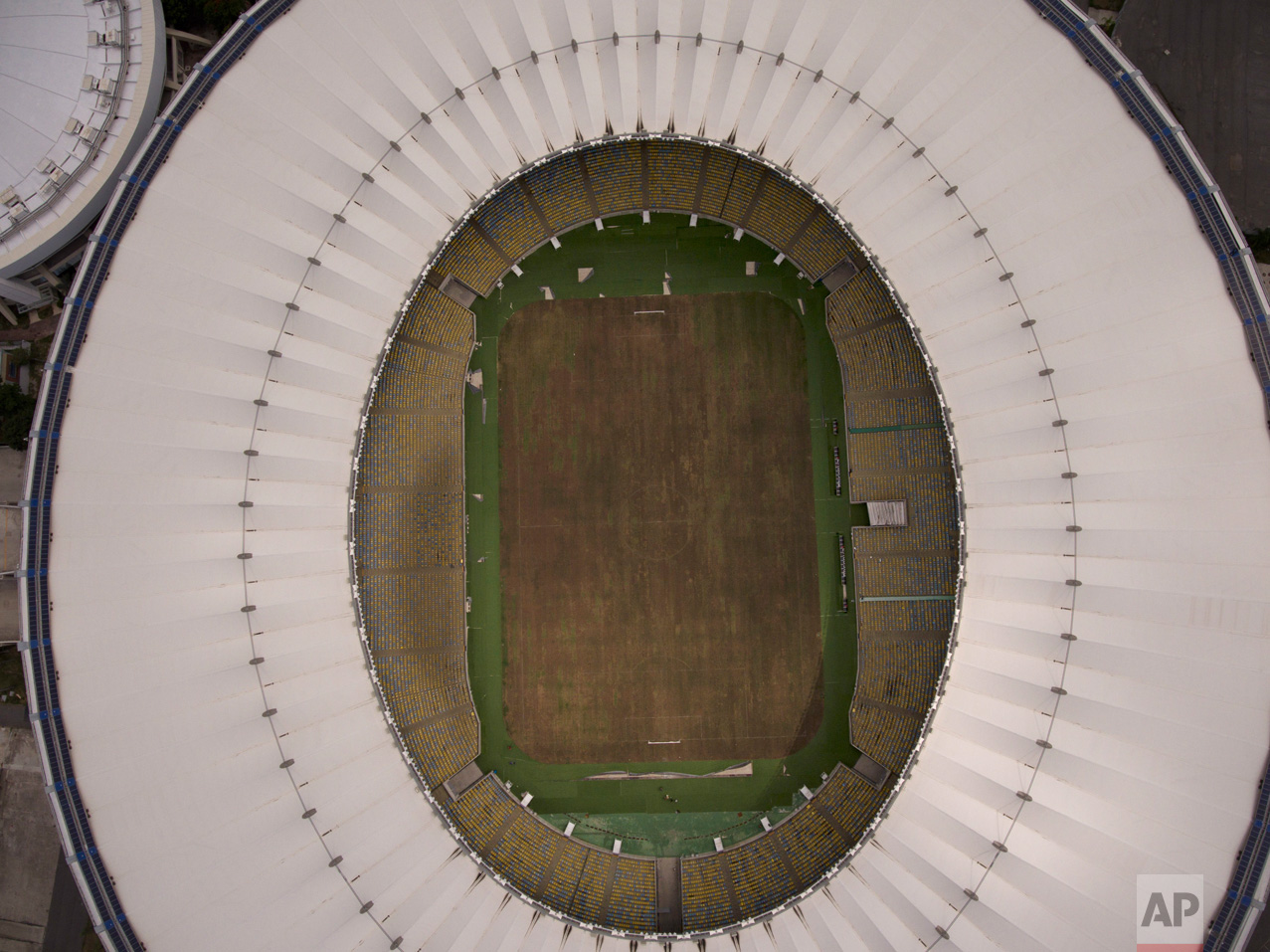  This Feb. 2, 2017 photo shows Maracana stadium's dry playing field in Rio de Janeiro, Brazil. The stadium was renovated for the 2014 World Cup at a cost of about $500 million, and largely abandoned after the Olympics and Paralympics, then hit by van