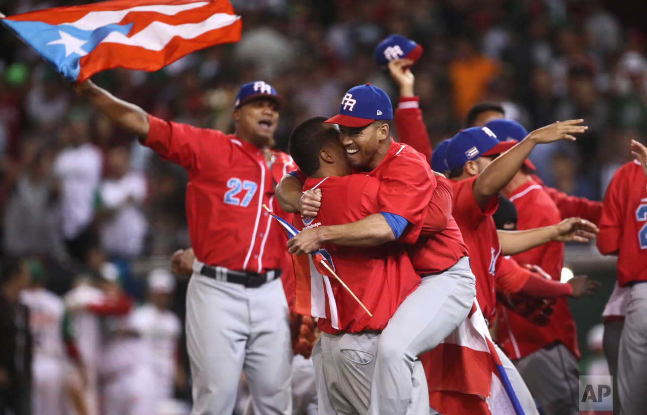 Puerto Rico's Criollos de Caguas players celebrate after the team won the Caribbean Series baseball championship title game, 1-0 over Mexico's Aguilas de Mexicali in Culiacan, Mexico, Tuesday, Feb. 7, 2017. (AP Photo/Luis Gutierrez)