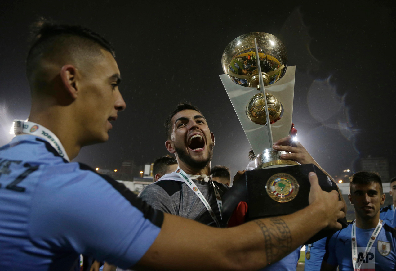  In this Feb. 11, 2017 photo, Uruguay's goalkeeper Santiago Mele, center, celebrates his team's victory at the U-20 South America qualifying soccer tournament in Quito, Ecuador. Uruguay, Brazil, Ecuador and Venezuela qualified for the 2017 South Kore