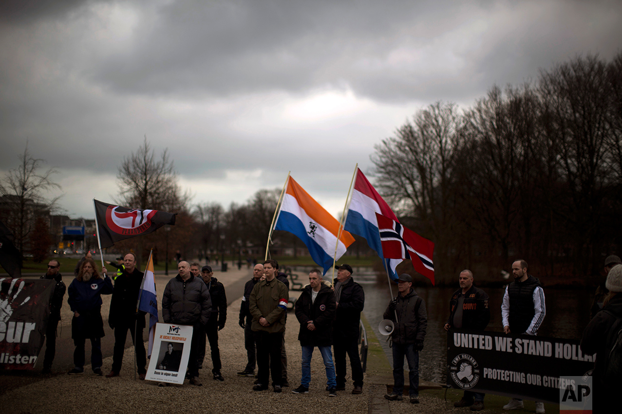 In this Saturday, March 4, 2017 photo, members and supporters of the extreme right wing Nederlandse Volks-Unie (Netherlands People's Union) demonstrate in The Hague ahead of Parliamentary elections scheduled for March 15. The NVU is not fielding any candidates in the election but said it was using Saturday's demonstration to give its supporters voting advice. (AP Photo/Emilio Morenatti)