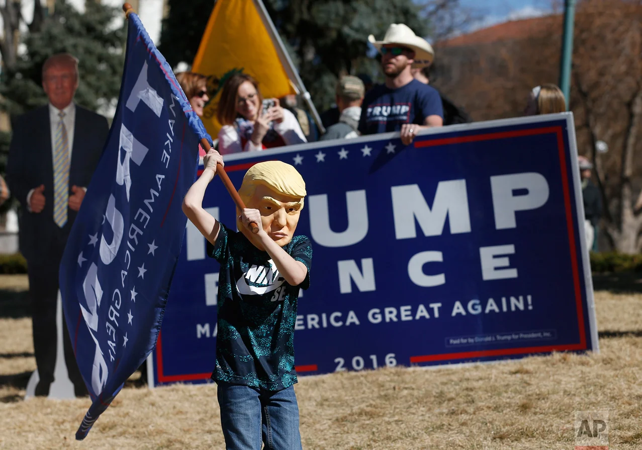 Supporters of President Donald Trump gather during a March 4 Trump rally at the state capitol in Denver, Saturday, March 4, 2017. (AP Photo/Brennan Linsley)
