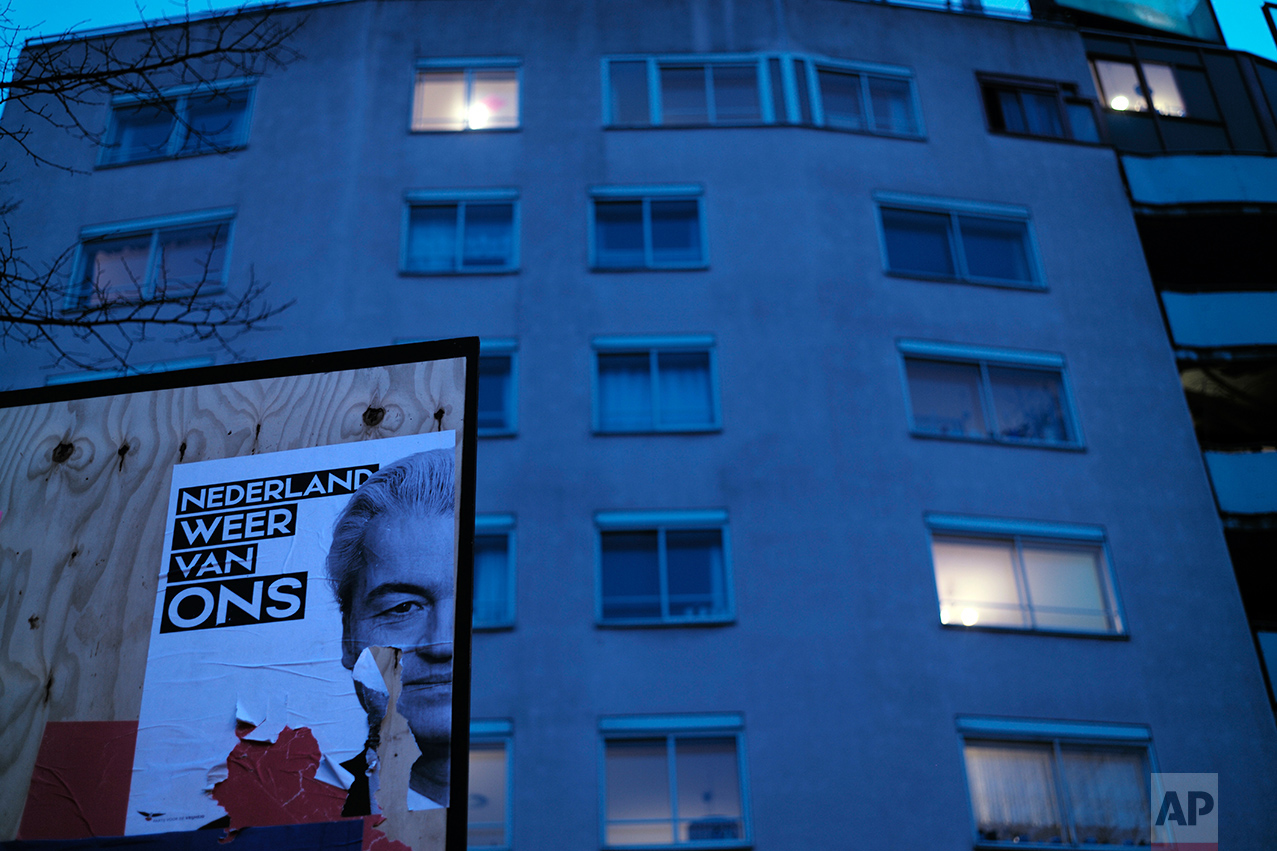  A damaged election poster showing firebrand anti-Islam lawmaker Geert Wilders, is displayed on a billboard in Amsterdam, Netherlands, Monday, March 13, 2017. (AP Photo/Muhammed Muheisen) 
