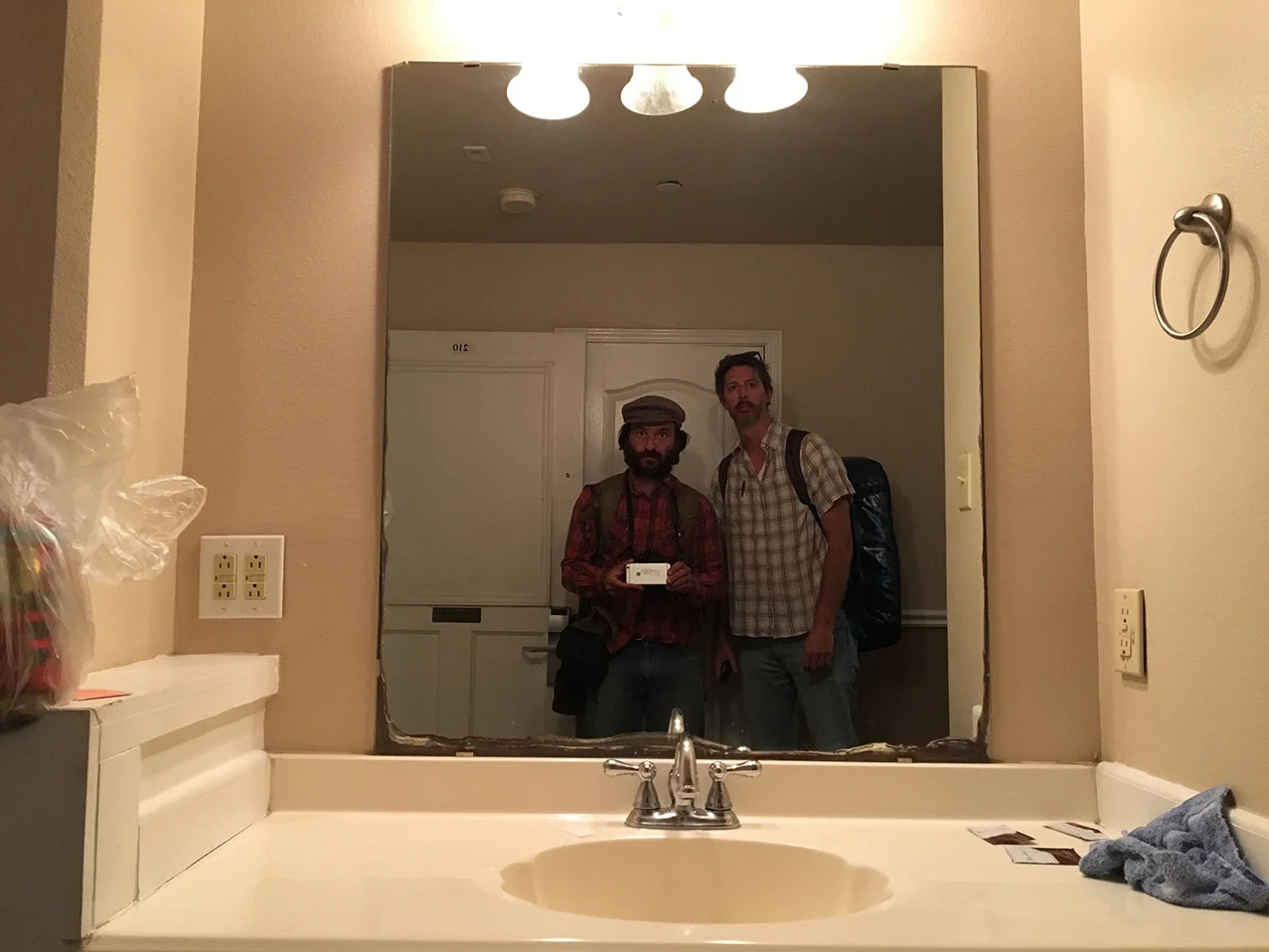 AP photographer Rodrigo Abd, left, and writer Christopher Sherman pose for a selfie inside their hotel room, March 24, 2017, Laredo, Texas. (AP Photo/Rodrigo Abd)