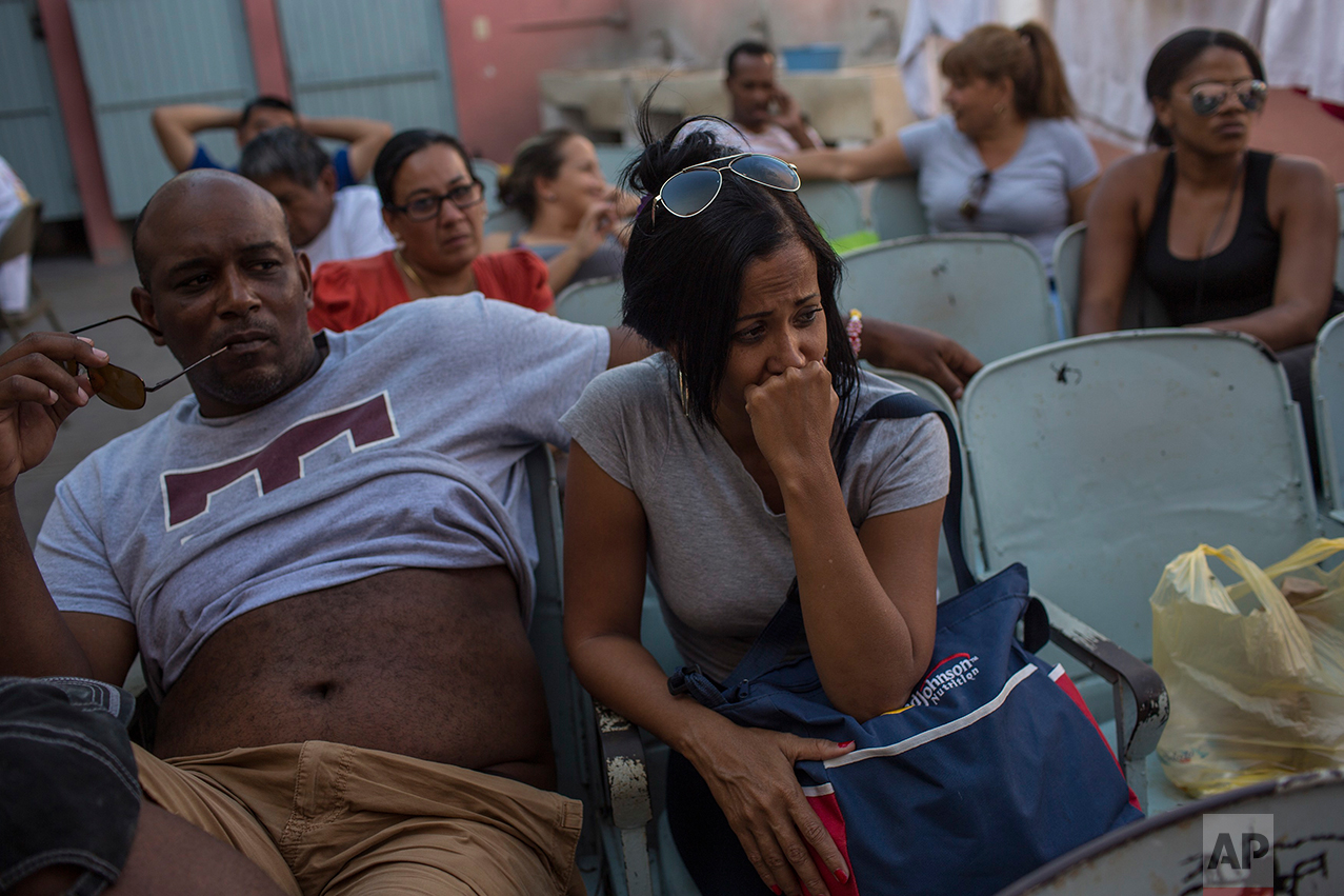Cubans sit in the migrant shelter "Casa del Migrante" in Nuevo Laredo, Tamaulipas state, Mexico, Saturday, March 25, 2017, across the border from Laredo, Texas. (AP Photo/Rodrigo Abd)