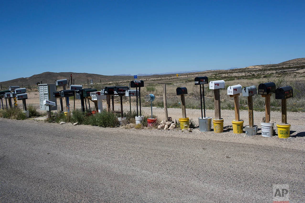 Mail boxes stand in a line in Terlingua, Texas, near the US-Mexico border, Monday, March 27, 2017. (AP Photo/Rodrigo Abd)