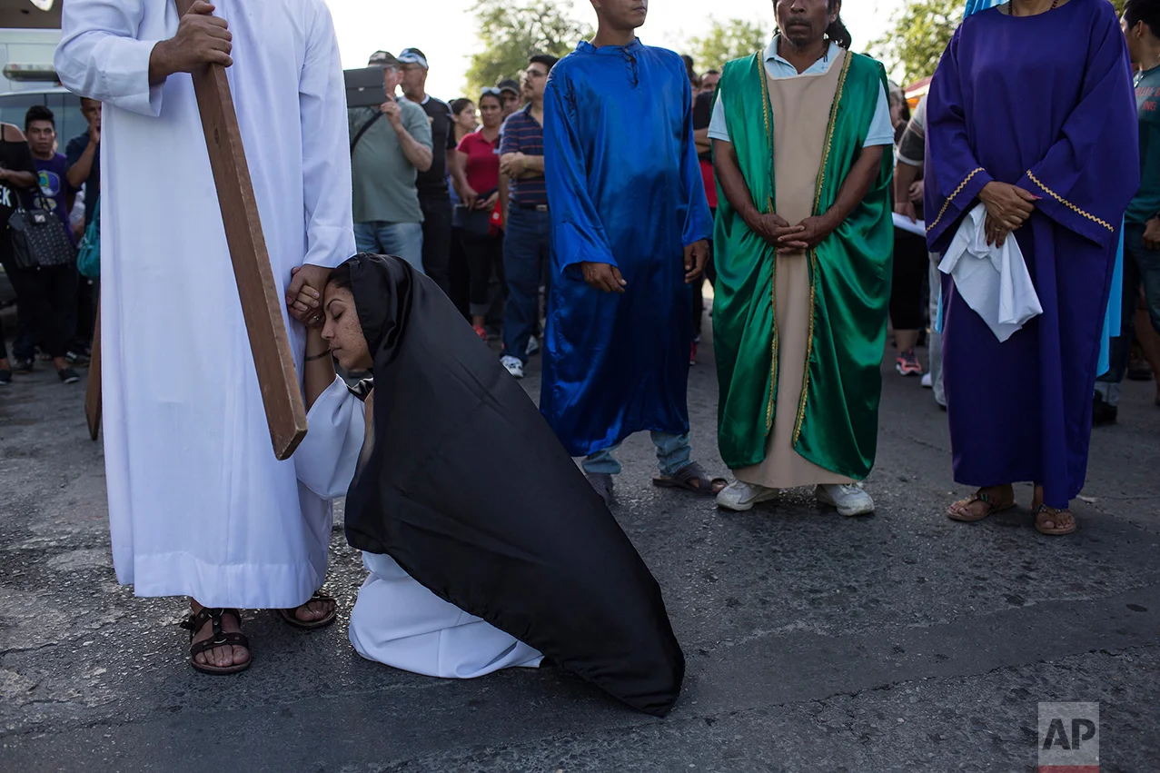 Cuban migrant Maite Silva performs the role of the Virgin Mary during a religious procession adapted to reflect the plight of immigrants, in Nuevo Laredo, Tamaulipas state, Mexico, Friday, March 24, 2017, across the border from Laredo, Texas. (AP Photo/Rodrigo Abd)