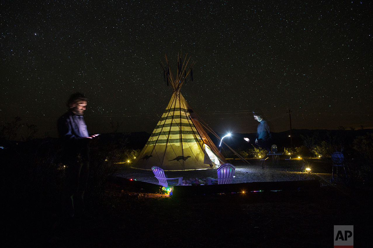  Associated Press team, writer Christopher Sherman, right, and photographer Rodrigo Abd, stand next to their tipi-style tent lodging at Tin Valley Retro Rentals in Terlingua, Texas, near the US-Mexico border, Monday, March 27, 2017. The AP has sent t
