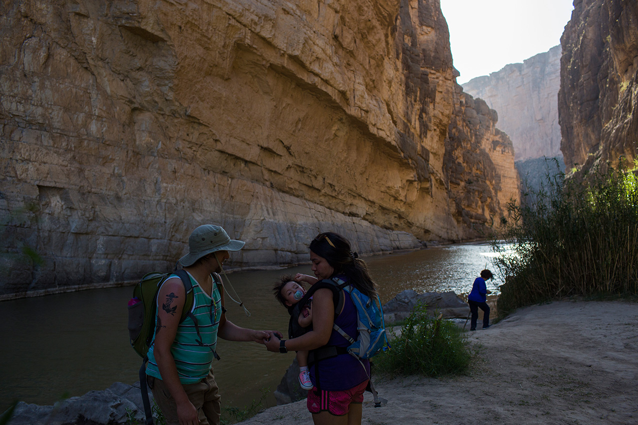  Tourists stand in Santa Elena Canyon, on the bank of the Rio Grande river, just feet from a cliff face that is Mexico, left, as they vacation at Big Bend National Park in Texas, Monday, March 27, 2017. (AP Photo/Rodrigo Abd) 