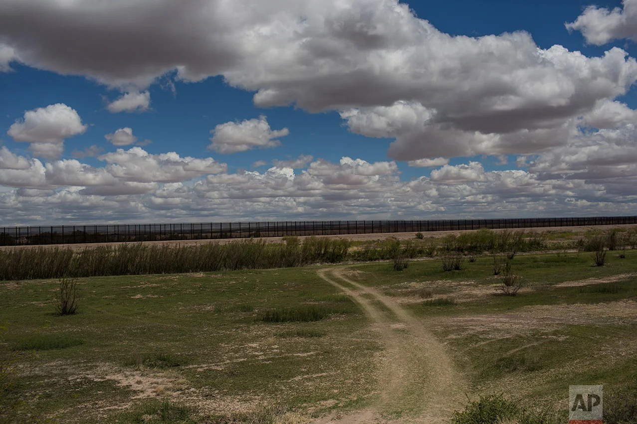 A fence marks the border between Mexico and the U.S. in the Juarez Valley, Mexico, Wednesday, March 29, 2017, across the border from the outskirts of El Paso, Texas. This border fence was planned and started before President Donald Trump's election. (AP Photo/Rodrigo Abd)