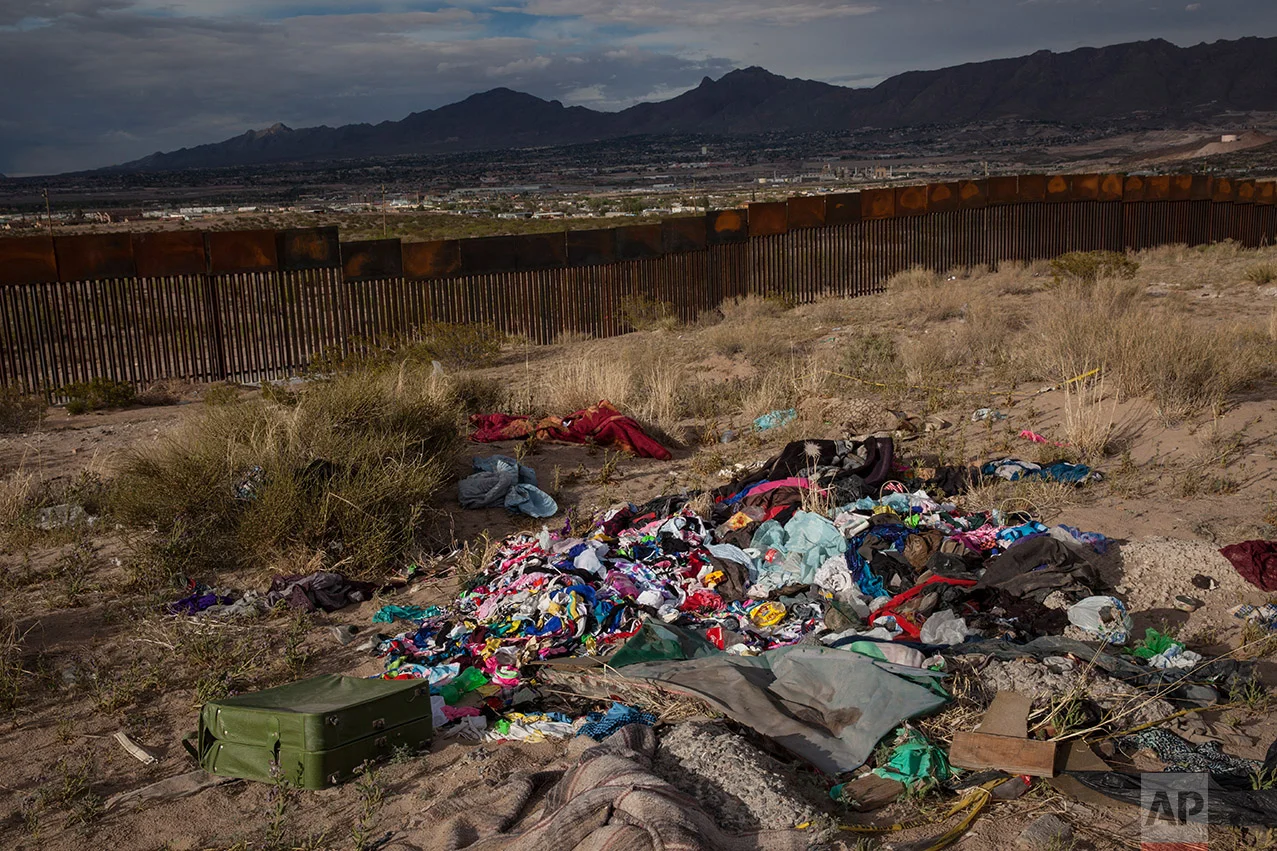 Clothes lay abandoned near a newly erected fence at the U.S.-Mexico border in the Anapra neighborhood of Ciudad Juarez, Mexico, Wednesday, March 29, 2017, across from Sunland Park, New Mexico. Residents of Anapra, a neighborhood anchored to the dunes, have fought to get running water, electricity and some paved streets in recent years. (AP Photo/Rodrigo Abd)
